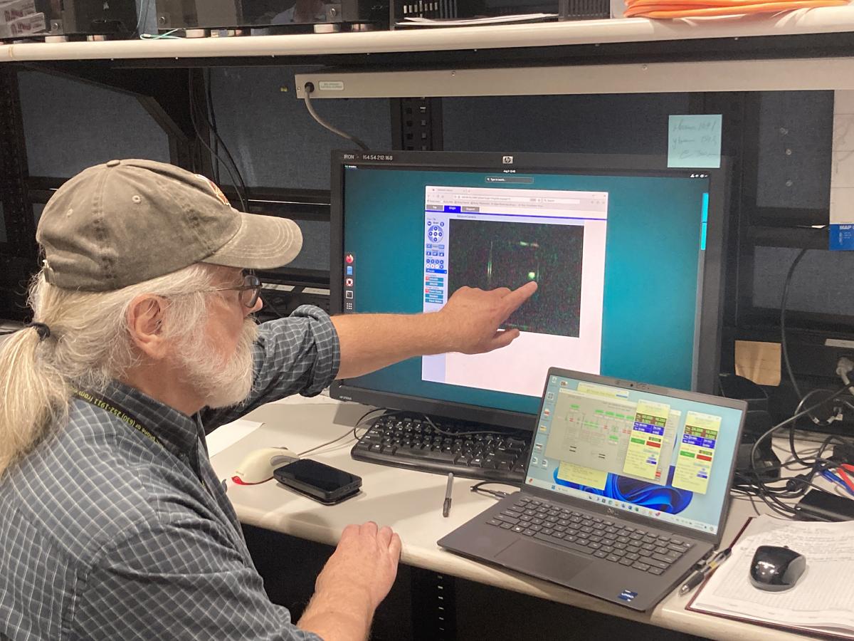 Dr. Capel observing beam on the monochromator